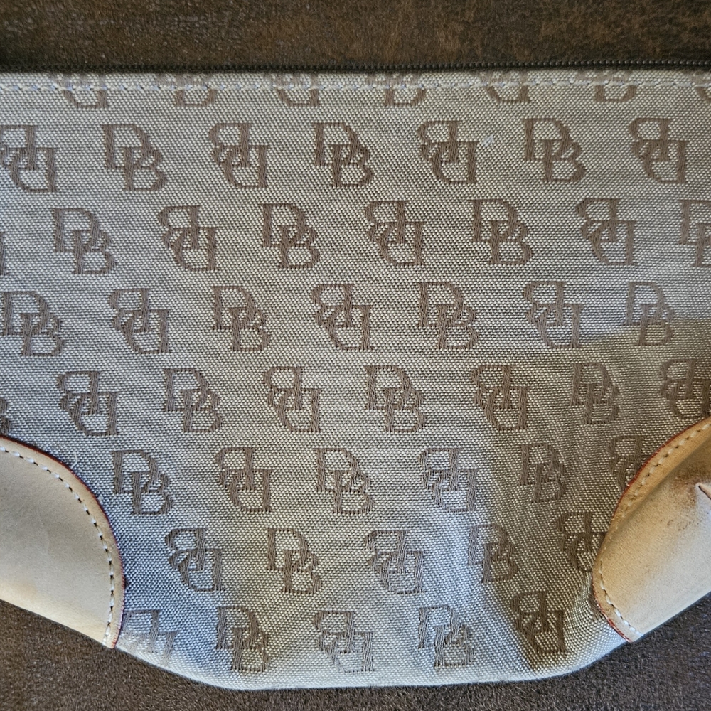 Dooney & Bourke monogram jacquard canvas cosmetic bag with tan leather corners